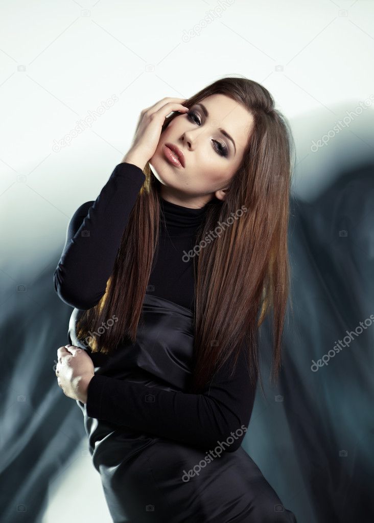 Young woman wearing gorgeous black dress
