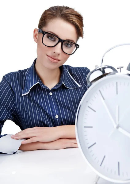 Young businesswoman with a big clock Royalty Free Stock Photos