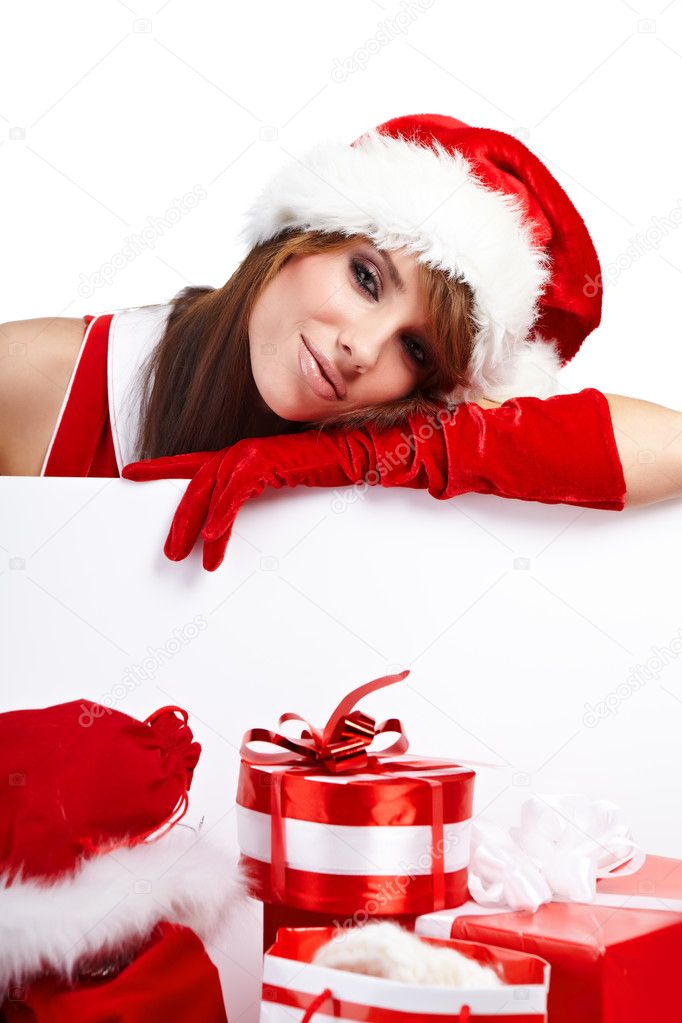 Sexy christmas girl smiles and holding a gift in packing Stock Photo by ©zoomteam 6449780