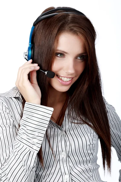 Klant ondersteuning meisje met hoofdtelefoon lacht tijdens een telefoon — Stockfoto