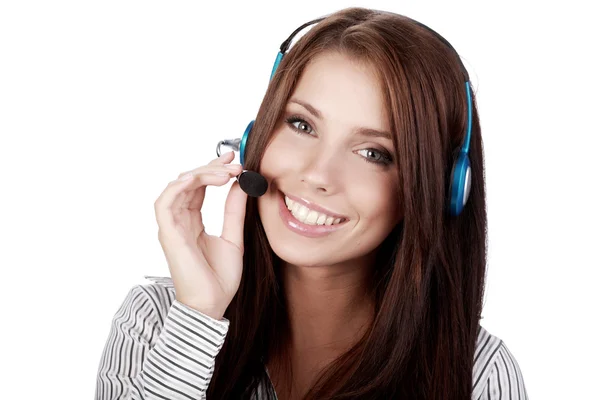 Chica de atención al cliente con auriculares sonriendo durante un teléfono —  Fotos de Stock
