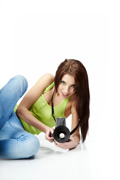 Young woman with photo camera. Isolated over white background — Stock Photo, Image