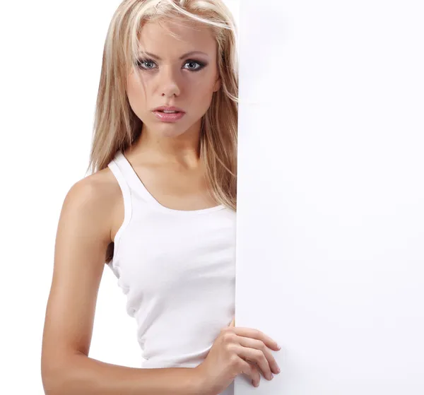Sexy chica sosteniendo un cartel añadir aislado sobre un blanco backgrou — Foto de Stock