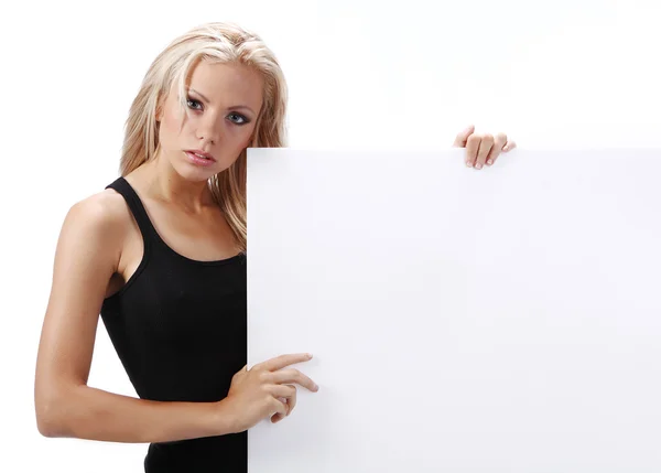 Sexy girl holding a billboard add isolated over a white backgrou — Stock Photo, Image