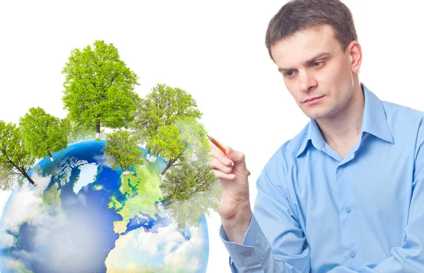 Caucasian businessman drawing tree on the Earth — Stock Photo, Image