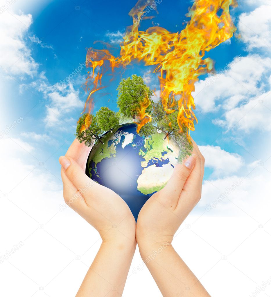 Womanish hands holding burning Earth.