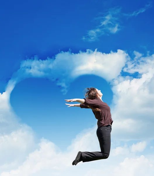 Heart of clouds and girl — Stock Photo, Image