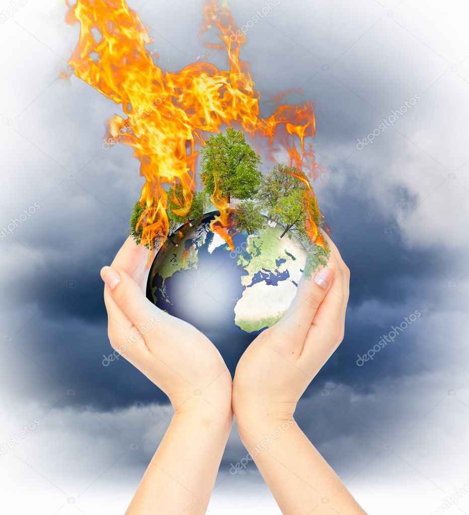 Womanish hands holding burning Earth.