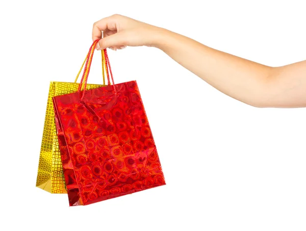 Mano de mujer con bolsas de compras —  Fotos de Stock