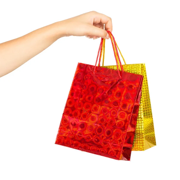 Mão de mulher com sacos de compras — Fotografia de Stock