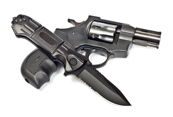 Nůž a revolver — Stock fotografie