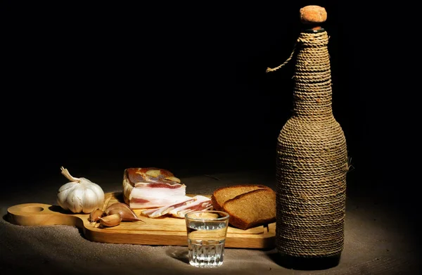 stock image Still-life with bacon, bread and vodka
