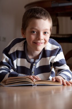 Boy reeding book clipart