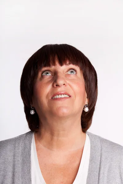 Mature woman looking up — Stock Photo, Image