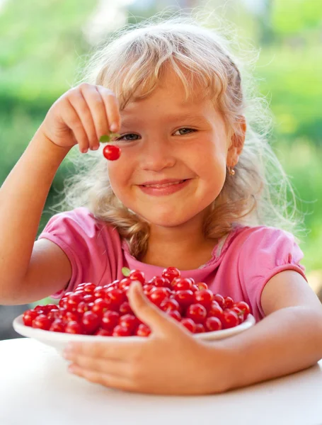 Little girl with cherry — Stock Photo, Image