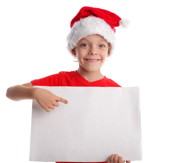 Bambino in un cappello di Natale e la forma in mani — Foto Stock
