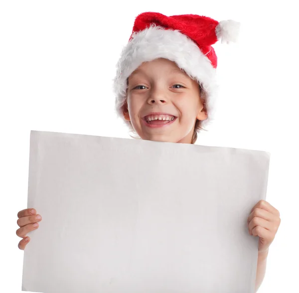 Enfant dans un chapeau de Noël et la forme dans les mains — Photo