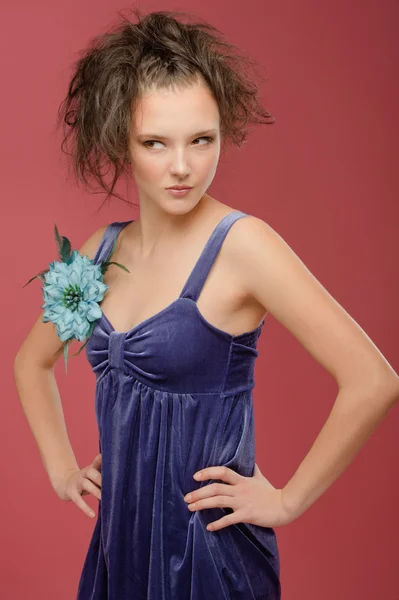 Beautiful young woman in a blue dress — Stock Photo, Image