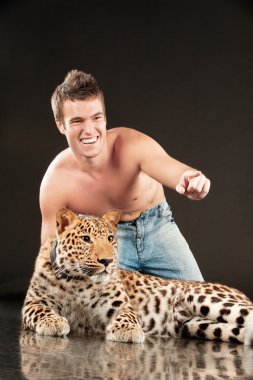 Young man and spotty leopard clipart