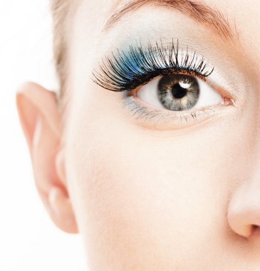 Eye and nose of beautiful young woman clipart