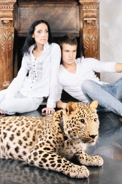 Mature woman and young man with spotty leopard clipart