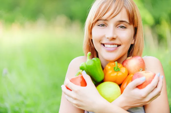 Beautiful girl with apples and sweet pepper — Stock Photo, Image