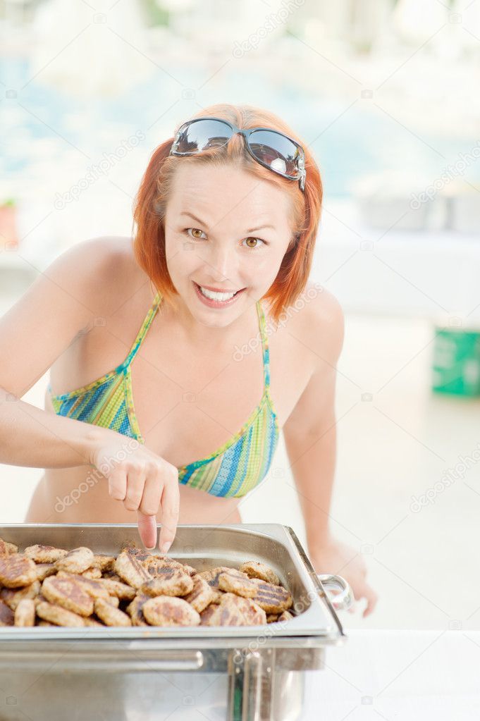 Woman cooks food