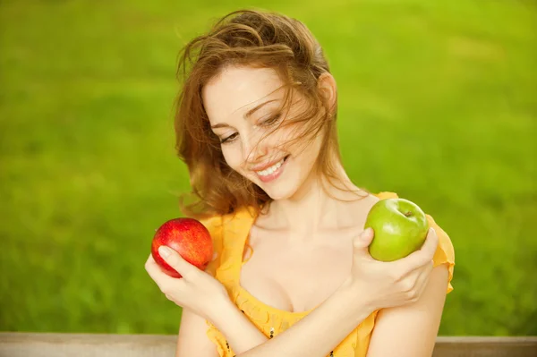 Girl with red apple Stock Image