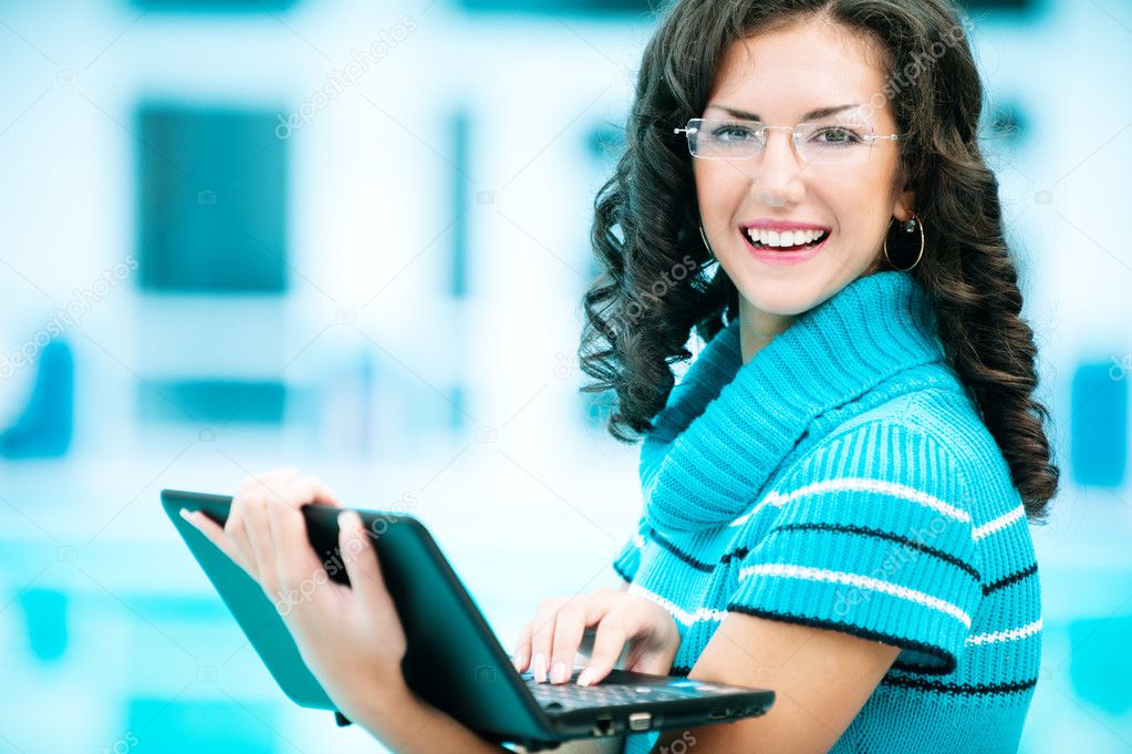 Business woman works on laptop
