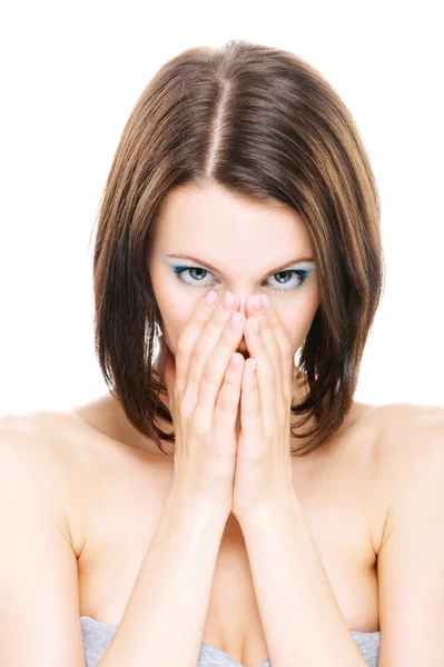 Woman with bared shoulders closes palms face — Stock Photo, Image