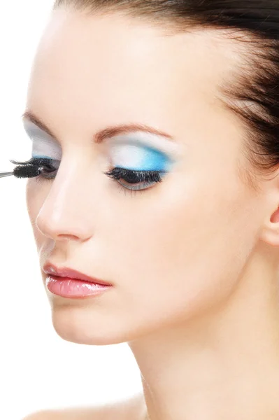Woman applying blusher eyelid Stock Photo