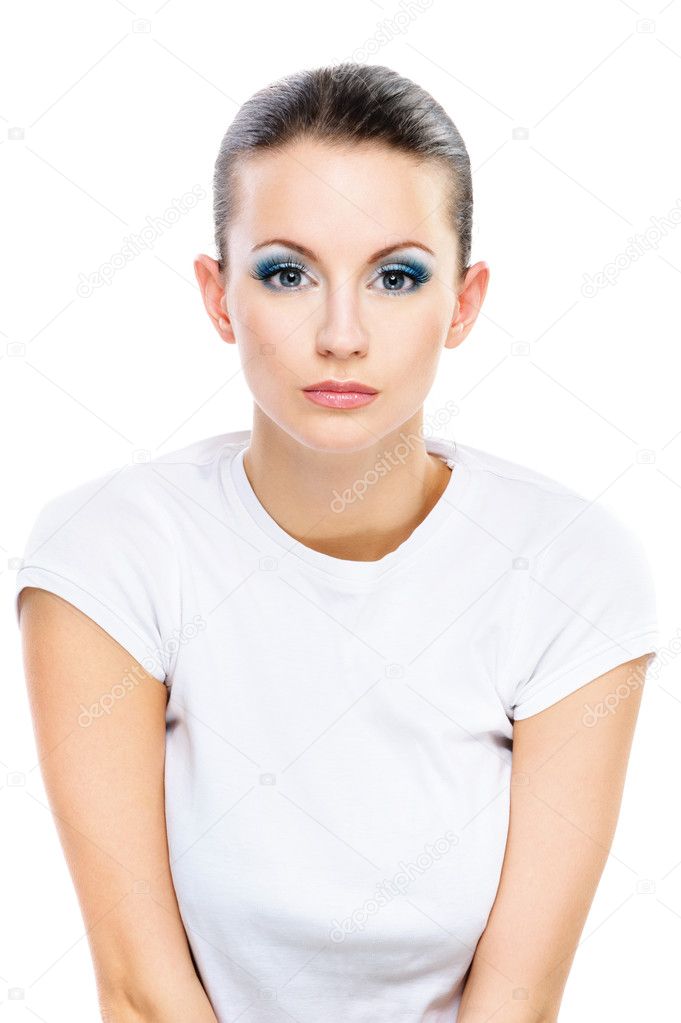 Serious dark-haired woman in white T-shirt