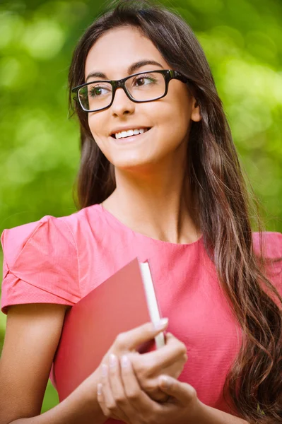 Woman glasses holds book — Stock Photo, Image