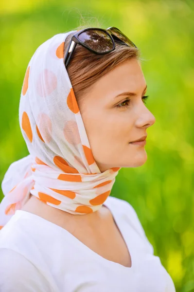 Portrait of young beautiful woman wearing shawl — Stock Photo, Image