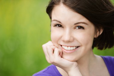 Portrait of young smiling woman clipart