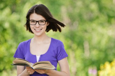 Young beautiful woman with book clipart