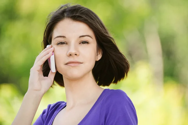 Portrait of young woman with phone — Stock Photo, Image