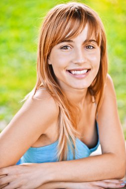 Portrait of young smiling woman clipart