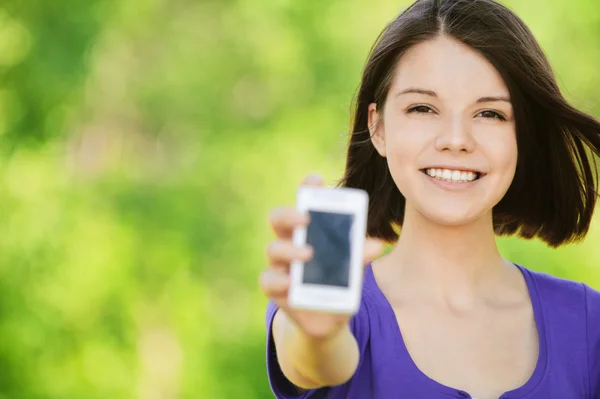Portrait of young smiling wonman holding mobile — Stock Photo, Image