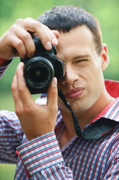 Young man taking photos — Stock Photo, Image