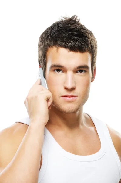 Portrait of young man speaking on mobile phone — Stock Photo, Image