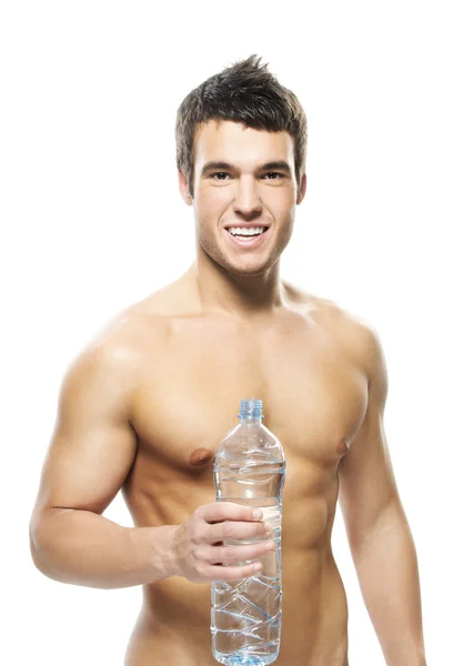 Portrait of young man holding bottle of water — Stock Photo, Image