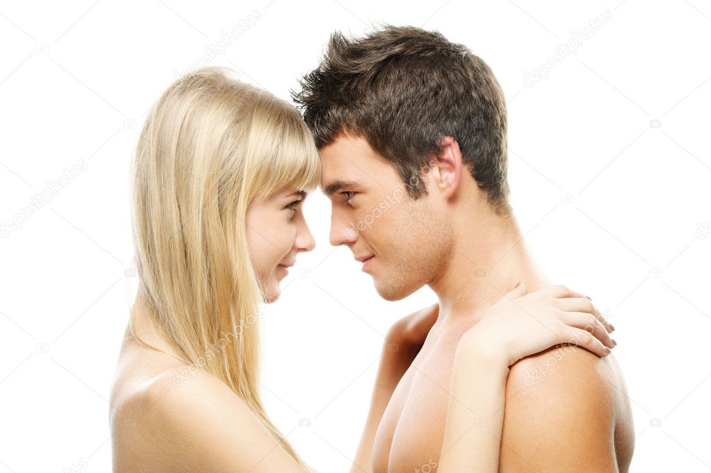 Young couple looking at each other against white background