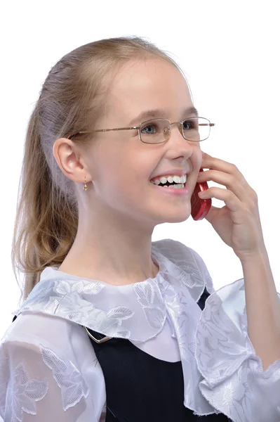 Porträt eines kleinen lachenden Mädchens am Telefon — Stockfoto