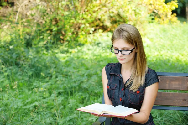 Young fair-haired woman reading book — Stock Photo, Image