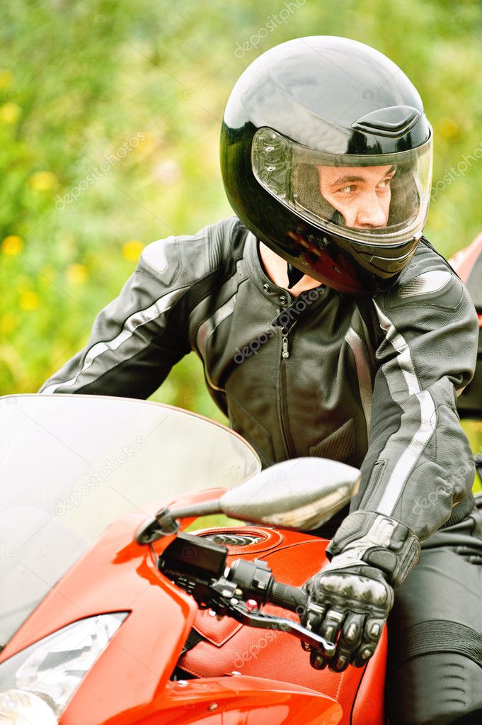 Portrait of young man driving motorcycle