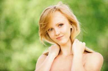 Portrait of young beautiful fair-haired woman