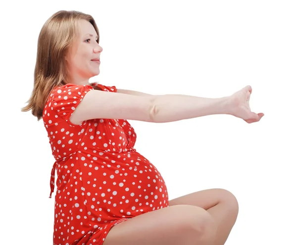 Porträtt av glad vacker gravid kvinna gör fysiska möjligheten — Stockfoto