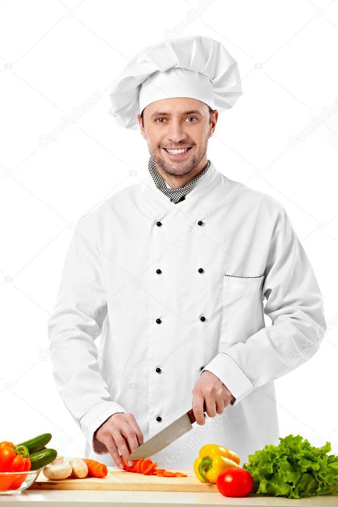 The young cook cut vegetables