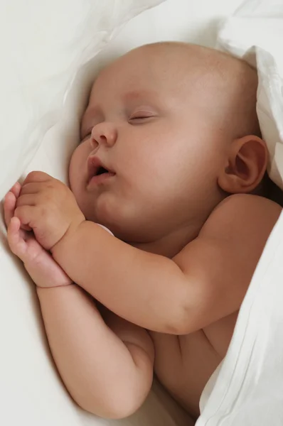 Vackra sovande baby Stockbild